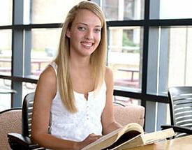 female student in library